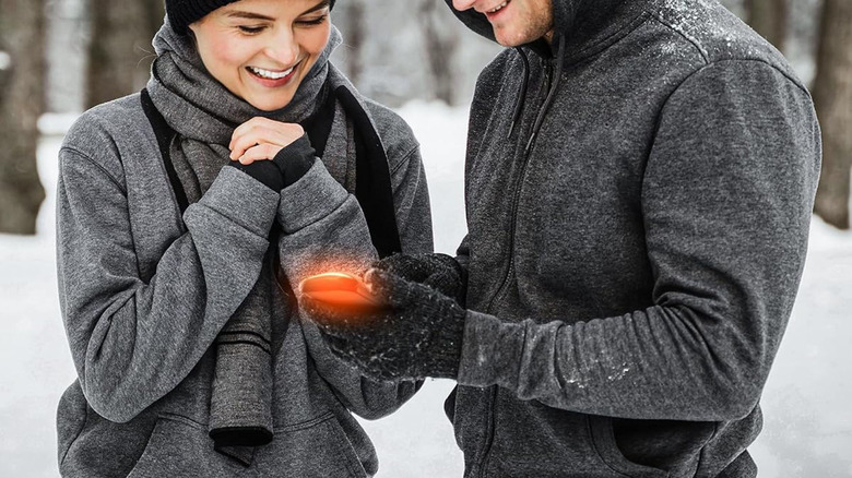 Using a Lerat rechargeable hand warmer on a snowy day