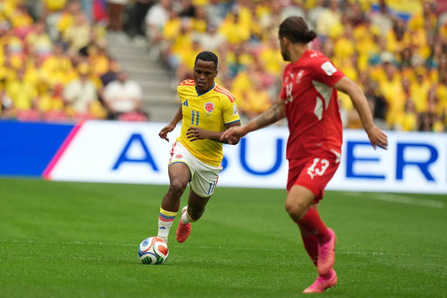 VANCOUVER, CANADA - JULY 07: Jhon Arias (11) of Colombia in action against Ricardo Rodriguez (13) of Switzerland during the 2026 FIFA World Cup Round of 16 match between Switzerland and Colombia at BC Place in Vancouver, British Columbia, Canada, on July 07, 2026 (Photo by Ercin Erturk/Anadolu via Getty Images)
