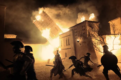 Universal Pictures In a scene near the end of the film, Odysseus recalls the battle of Troy in all its fury (Credit: Universal Pictures)