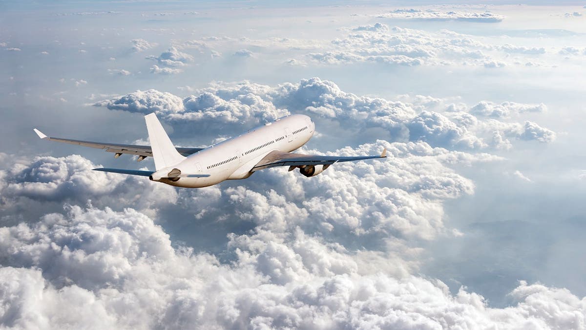 Airplane over clouds