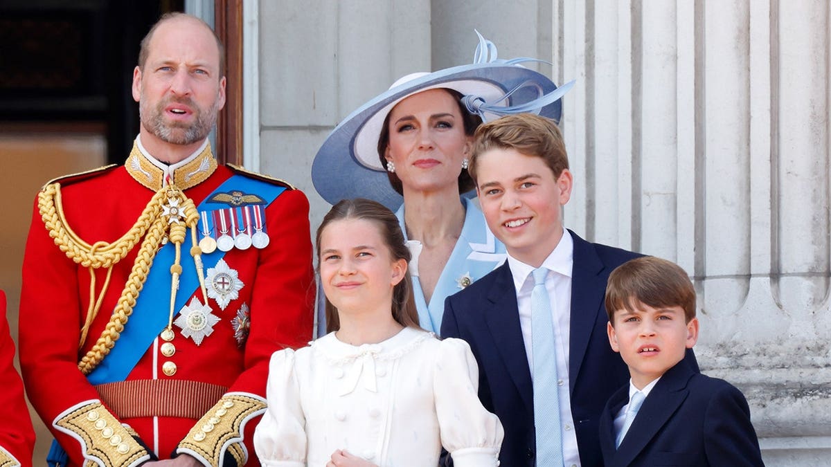 Prince William, Catherine, Princess Charlotte, Prince George and Prince Louis watch an RAF flypast from Buckingham Palace balcony.