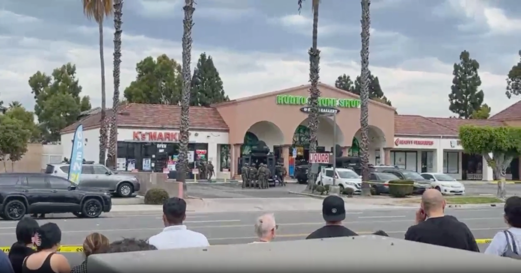 Man armed with knives and axe arrested after barricading inside Orange County business, police say Man armed with knives and axe arrested after barricading inside Orange County business, police say