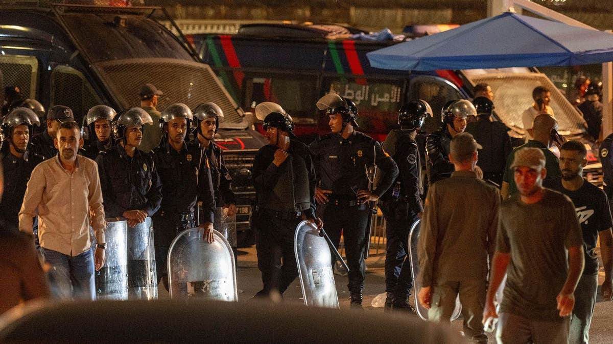 Security forces guard the border as migrants attempt to cross from Morocco into Spain's Ceuta enclave