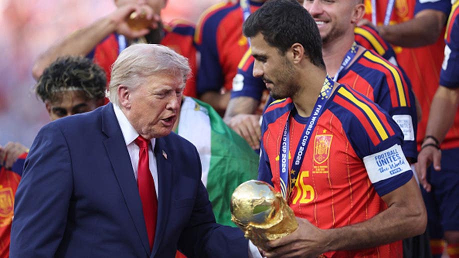 Donald Trump presents the FIFA World Cup trophy to Rodri.