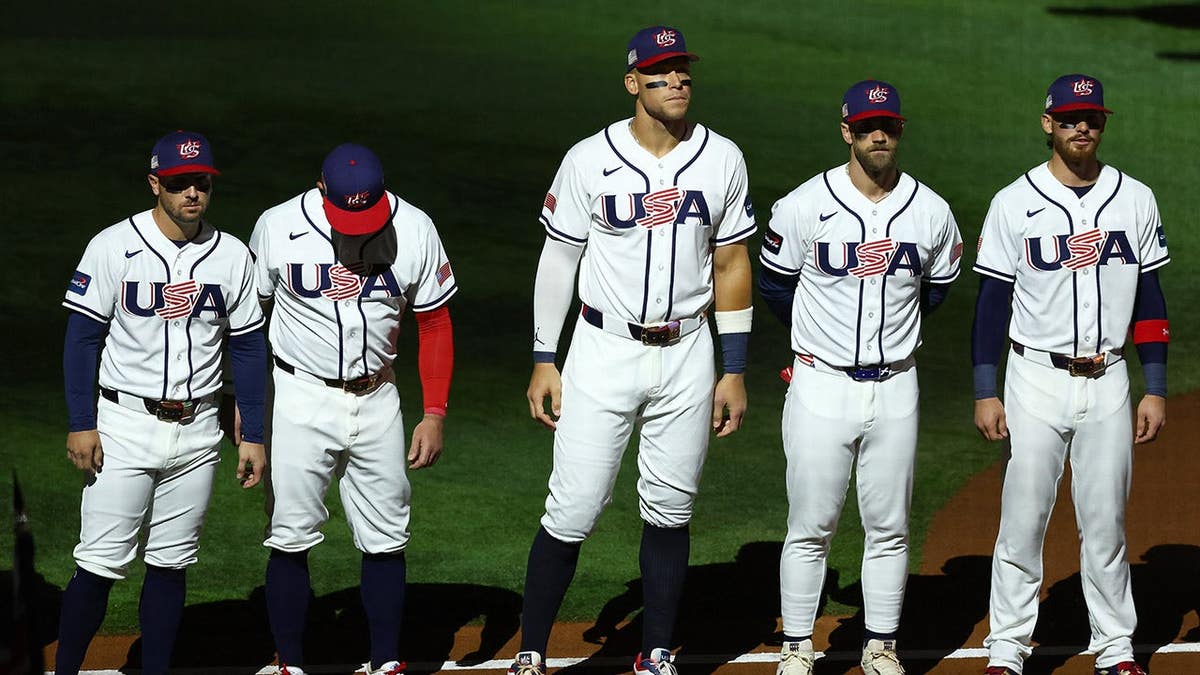 Aaron Judge stands with teammates at loanDepot park.