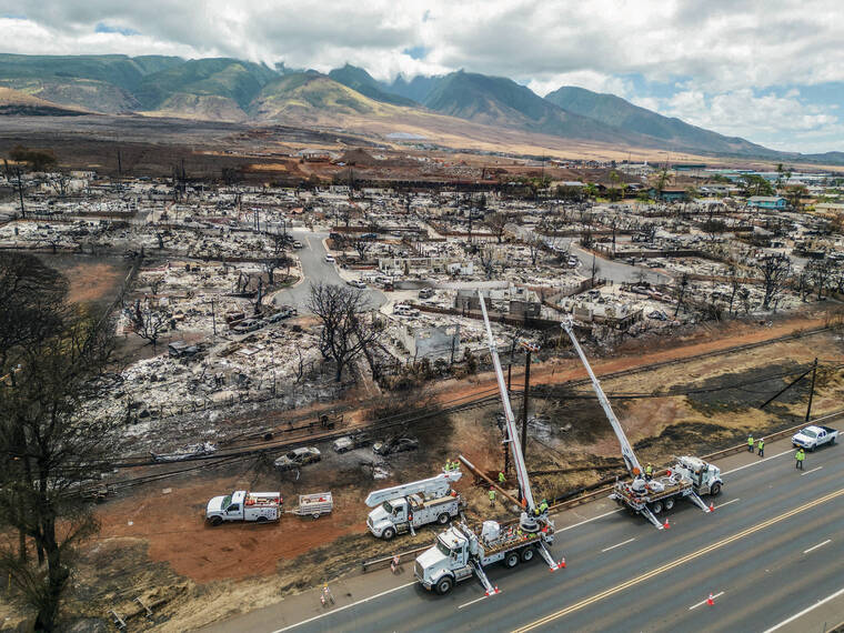 NEW YORK TIMES
Hawaiian Electric crews repair damaged power lines in Lahaina caused by the the August 2023 wildfire.