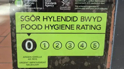 A hygiene rating on the front of the Slim Chickens venue