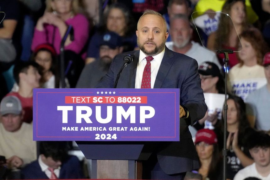 Rep. Russell Fry speaks ahead of a rally with Donald Trump in February 2024.
