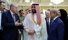 Turkish President Tayyip Erdogan, Saudi Crown Prince Mohammed bin Salman and Pakistan's Prime Minister Shehbaz Sharif chat after signing a joint defense agreement in Mecca, Saudi Arabia, Friday.