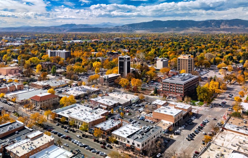 <strong>Gateway to the Rockies:</strong> Beyond downtown Fort Collins an urban treescape gives way to the Rocky Mountains.