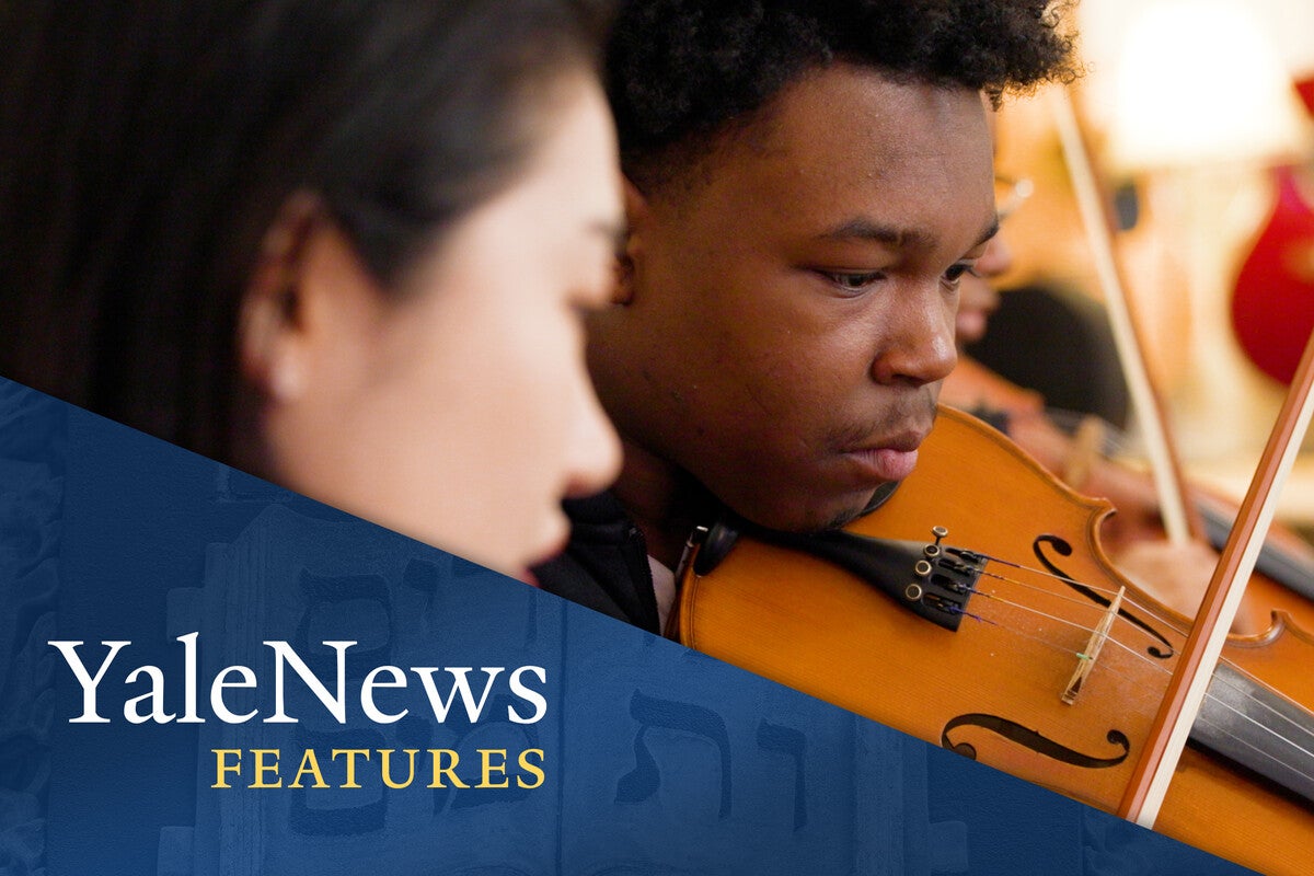Students playing stringed instruments.