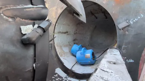 Earthgrid A tube four of five feet across formed in solid rock by the Earthgrid boring machine.