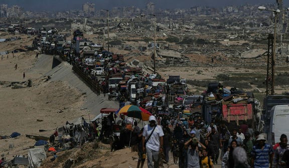 Displaced Gazans flee Gaza City, in 2025.