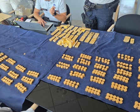 Bullion and nuggets laid out on a table