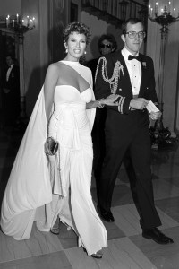 Raquel Welch and a military escort attend an event at the White House in Washington, D.C., on October 8, 1985. (Photo by Guy DeLort/WWD/Penske Media via Getty Images)