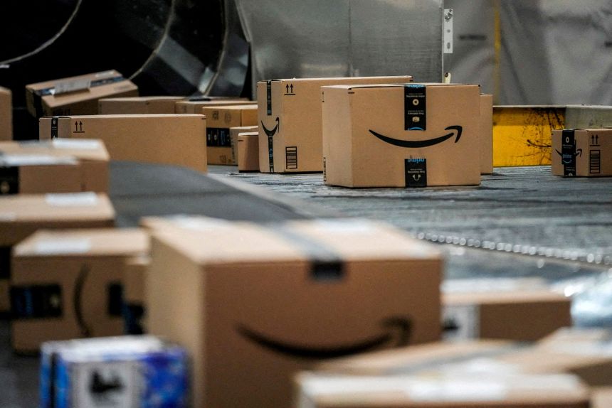 An Amazon box moves along a conveyor belt at Amazon’s fulfillment center in Robbinsville, New Jersey, on December 1, 2025.
