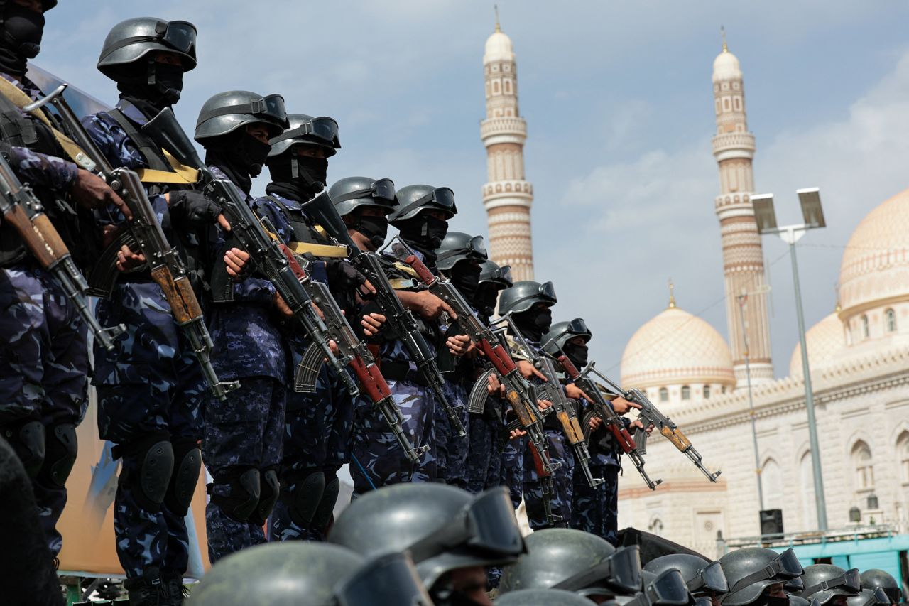 Members of Houthi security forces stand guard at a rally in Sanaa, Yemen, on July 17.