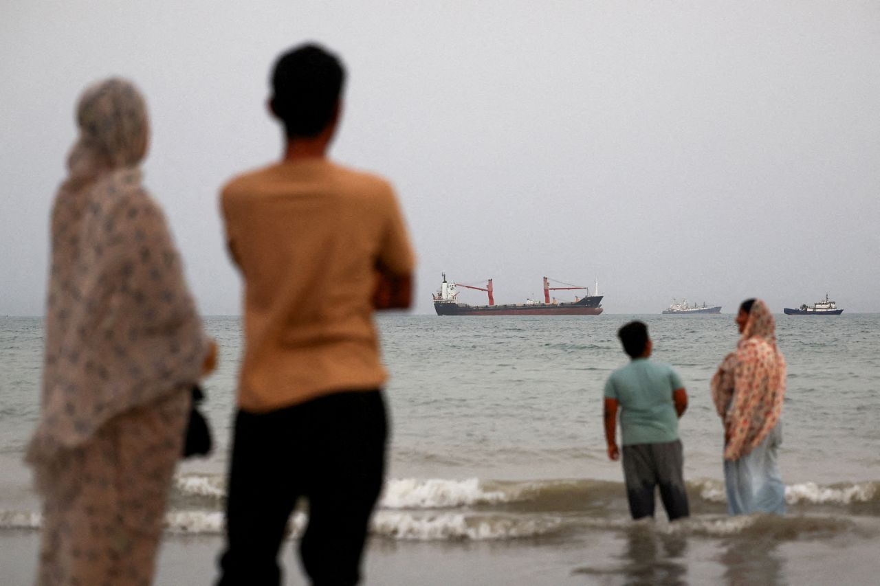 Vessels in the Strait of Hormuz are visible near the beach of Bandar Abbas, Iran, on May 22, 2026.