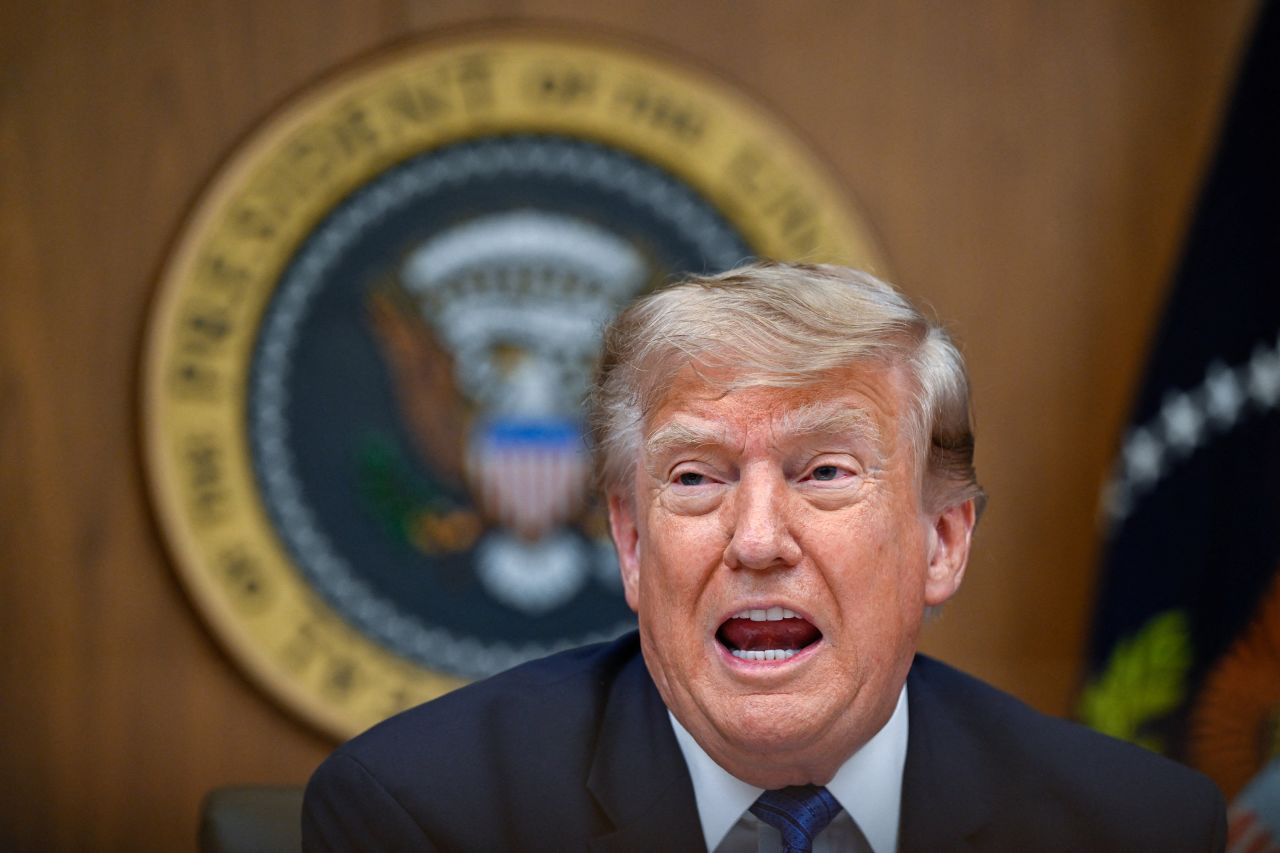 US President Donald Trump participates in a cabinet meeting at Camp David in Thurmont, Maryland, July 31.