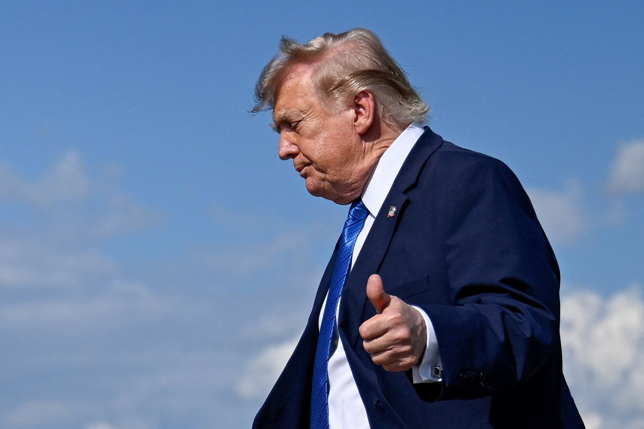 President Donald Trump gives thumbs-up as he walks to board Marine One following his arrival aboard Air Force One at Morristown Municipal Airport in Morristown, New Jersey, on Friday.
