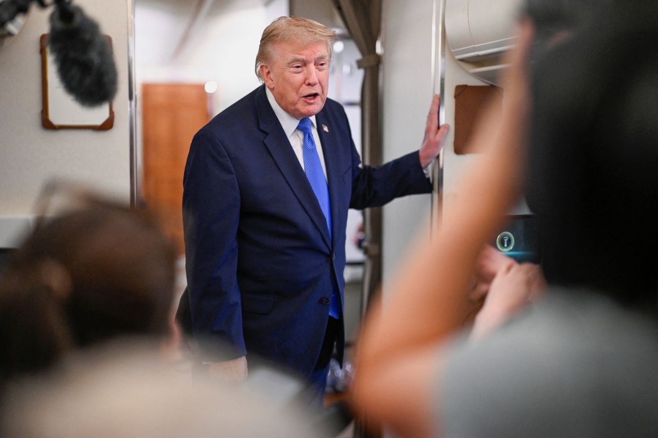 US President Donald Trump speaks to the media aboard Air Force One en route to Joint Base Andrews on Monday.