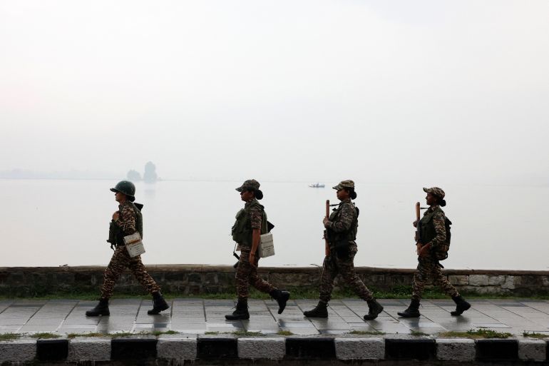 Central Reserve Police Force (CRPF) personnel patrol the banks of Dal Lake during a ‘Tiranga Yatra’ (patriotic march) before India’s Independence Day celebrations, in Srinagar, Indian-administered Kashmir, August 12, 2026