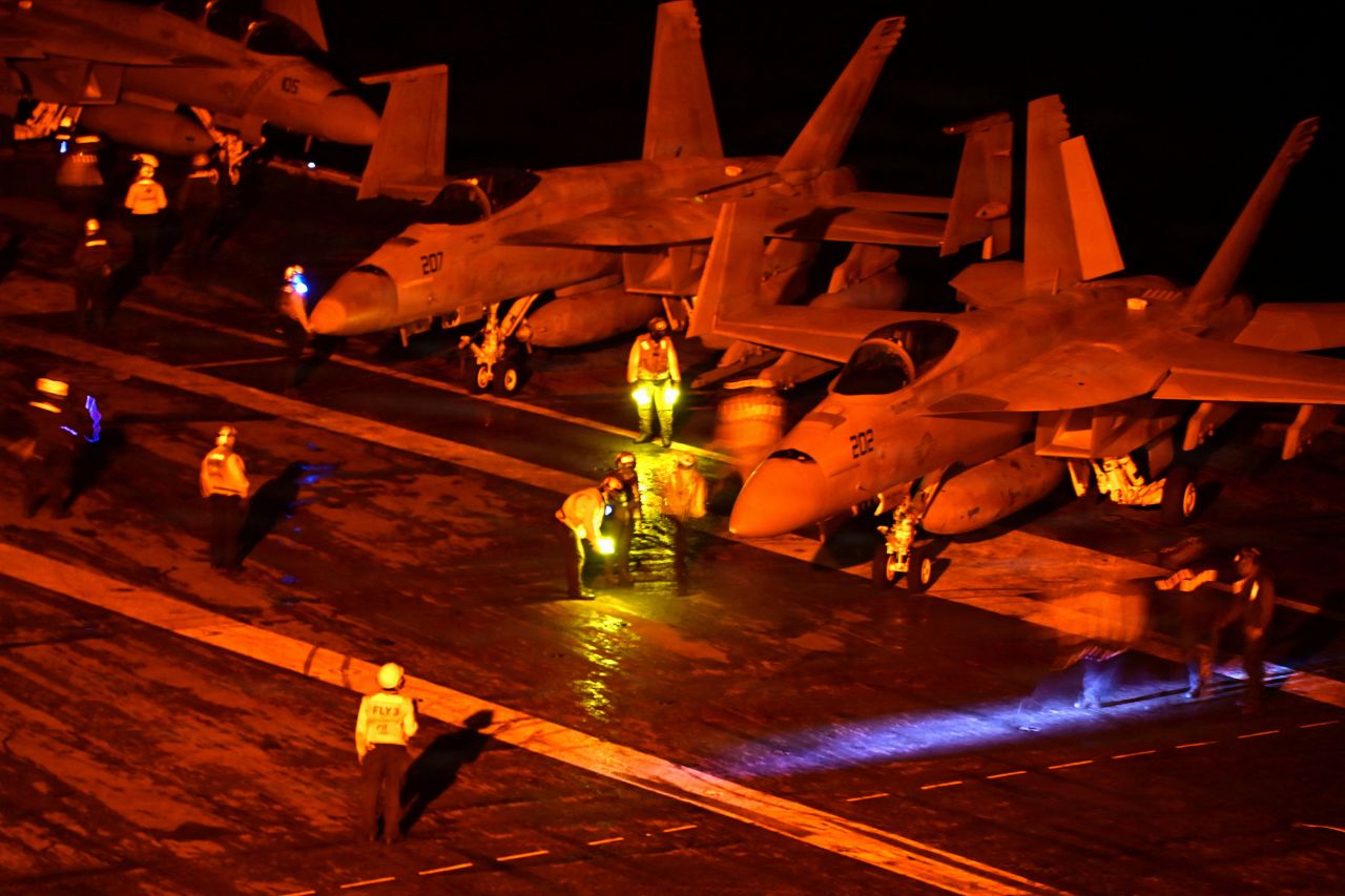 F/A-18 Super Hornets stand ready for launch on the flight deck of U.S. Navy Nimitz-class aircraft carrier USS George Washington while operating in the Indian Ocean on August 18.