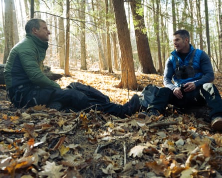 Bear Grylls talks to Dallas Jenkins in the woods in a scene from The Chosen In The Wild With Bear Grylls.