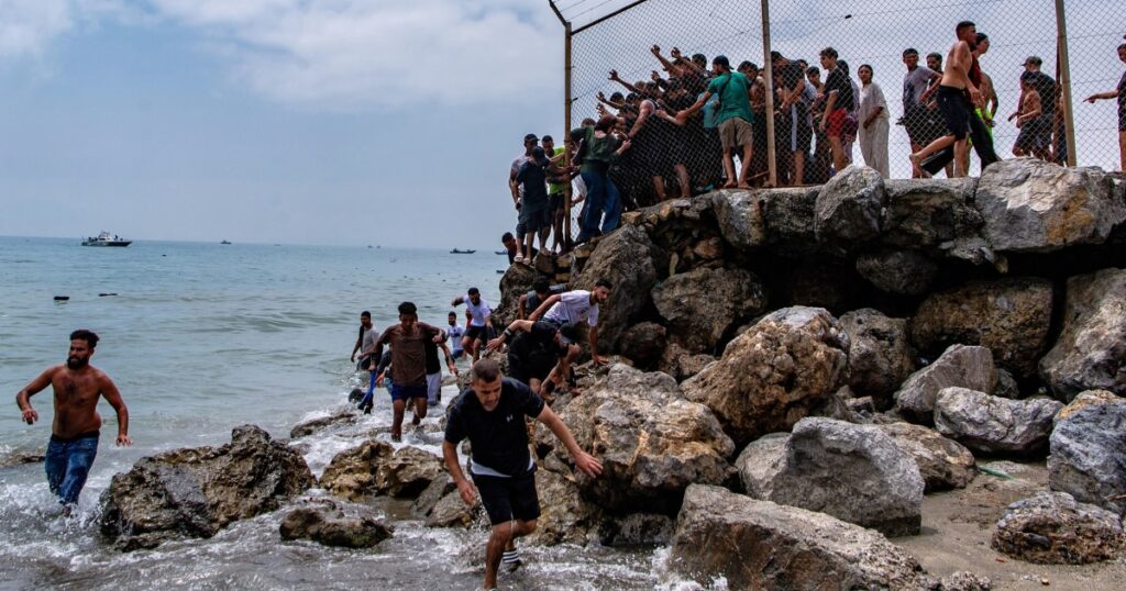 Runaway online rumors sparked frantic rush by migrants to the Spanish territory of Ceuta