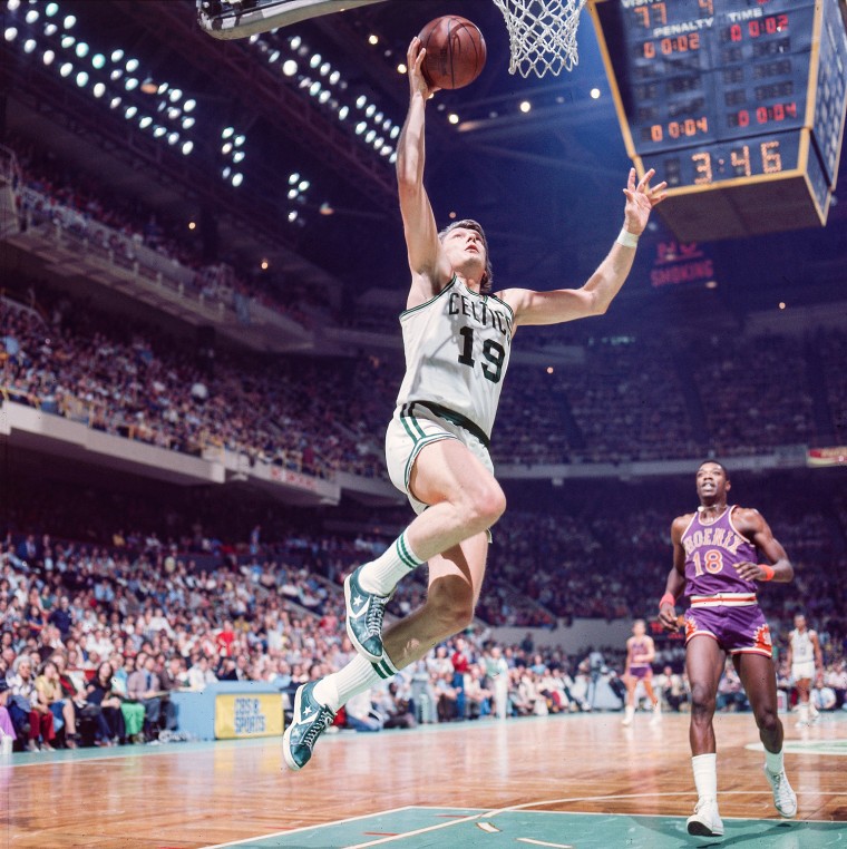 Don Nelson jumps up to make a basket on the court