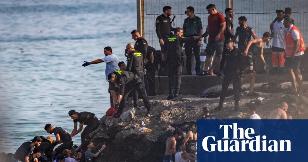 At least 57 people die as tens of thousands cross to Spanish enclave of Ceuta from Morocco
