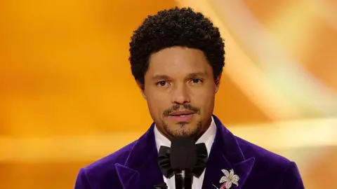 Getty Images for The Recording Academy Comedian Trevor Noah is seen at the Grammy Awards