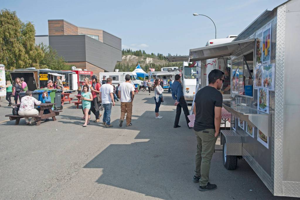Food trucks gather on Steele Street between Front and Second for the annual Street Eats Festival in August 2019. (Julien Gignac/Yukon News)