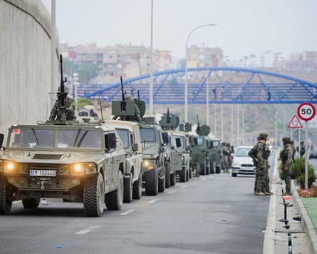 A line of military vehicles on a road