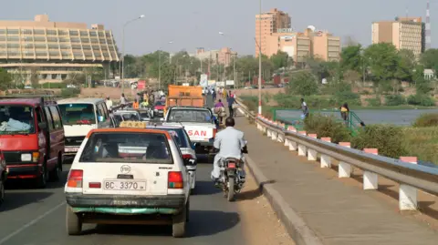 Getty Images File photo of vehicles crossing a bridge over the Niger river in Niamey
