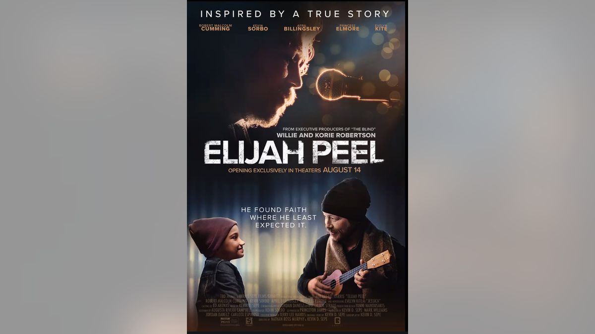 Robert Malcolm Cumming holding a small guitar looks at a young girl beneath the Elijah Peel movie title.
