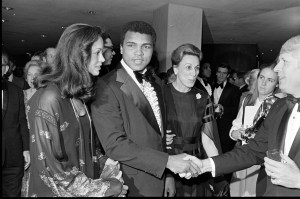 Veronica Porche (L) and Muhammad Ali (C) attend an event in Washington, D.C., on March 15, 1978. (Photo by Guy DeLort/WWD/Penske Media via Getty Images)