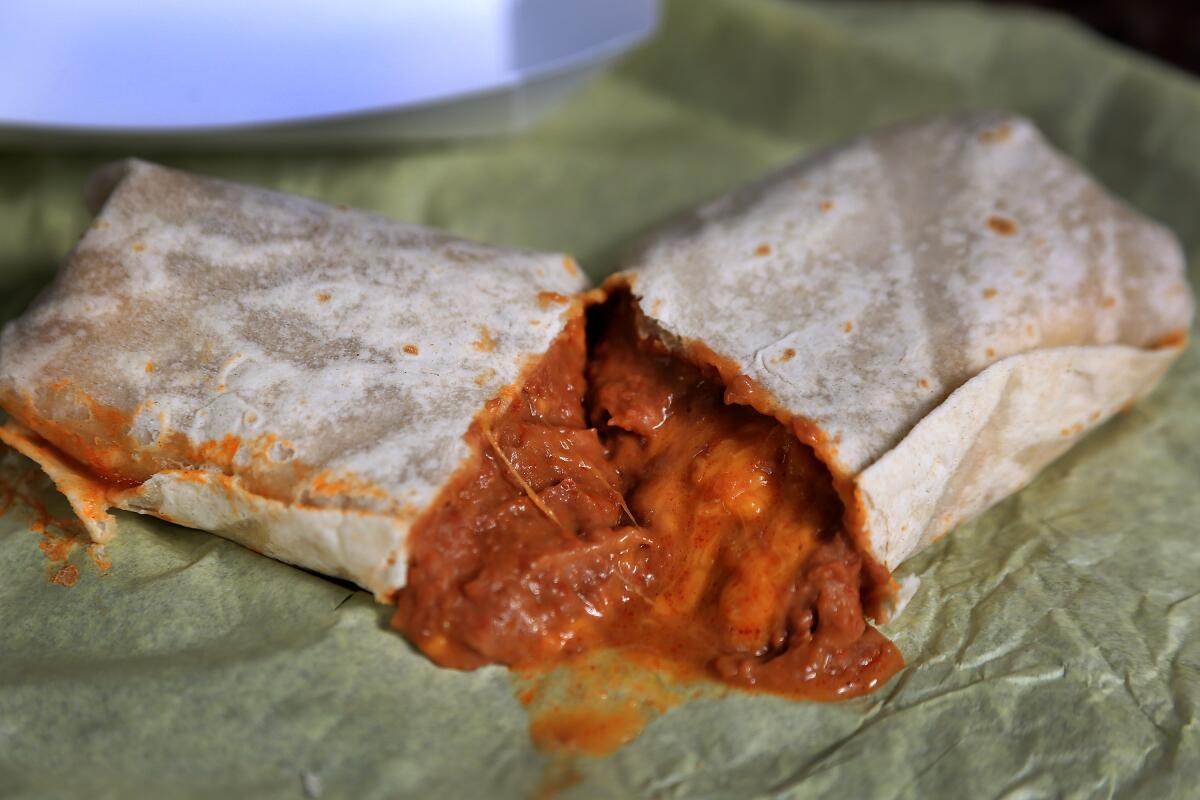 Al & Bea's bean and cheese burrito with green chile sauce.