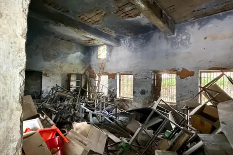 Geeta Pandey/BBC Falling plaster from ceiling has forced this school to abandon four of the nine classrooms