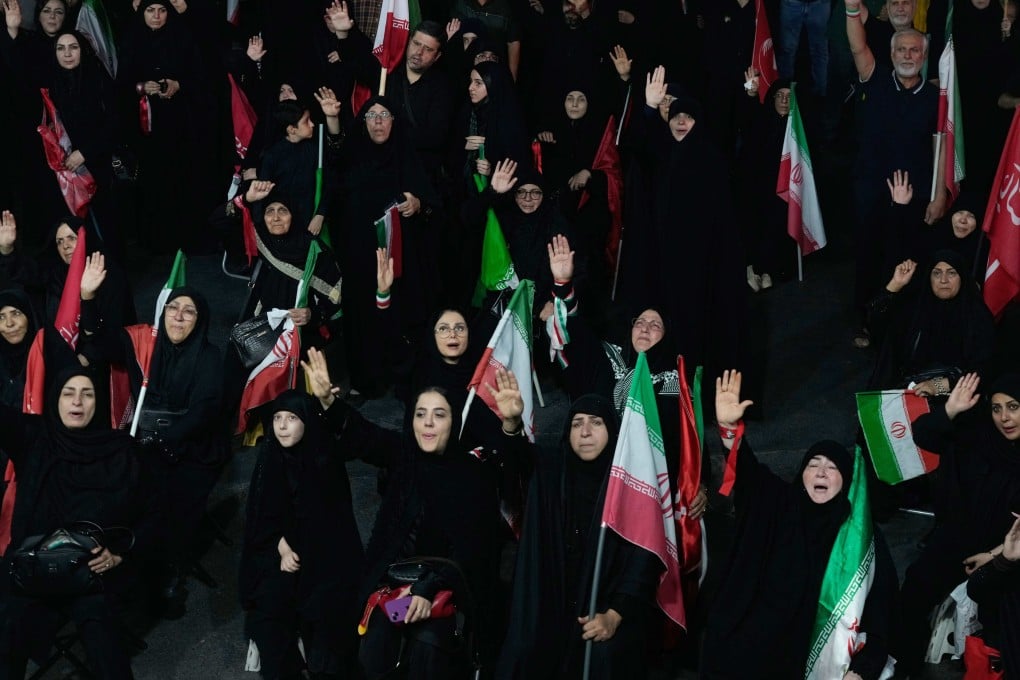 Iranian pro-government demonstrators attend a gathering at a square in Tehran on Tuesday. Photo: AP