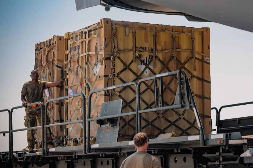 US Air Force aerial porters prepare to load Terminal High-Altitude Area Defense (THAAD) support equipment onto a C-17 Globemaster III in October 2024.