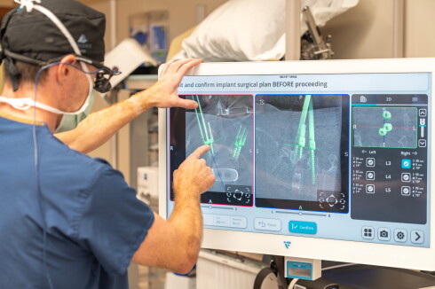 A doctor performs a surgery.