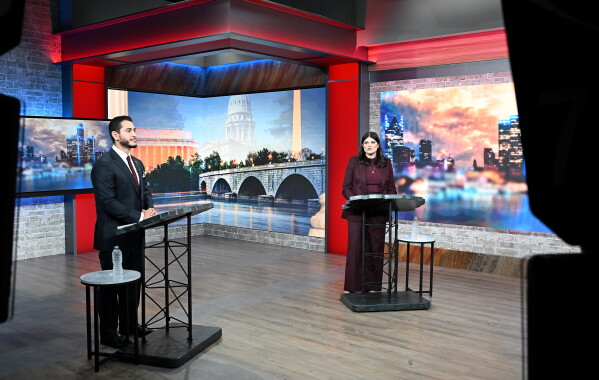 U.S. Senate candidates Abdul El-Sayed, left, and U.S. Rep. Haley Stevens participate in a televised debate, Monday, July 27, 2026, in Southfield, Mich. (Robin Buckson/Detroit News via AP, Pool)