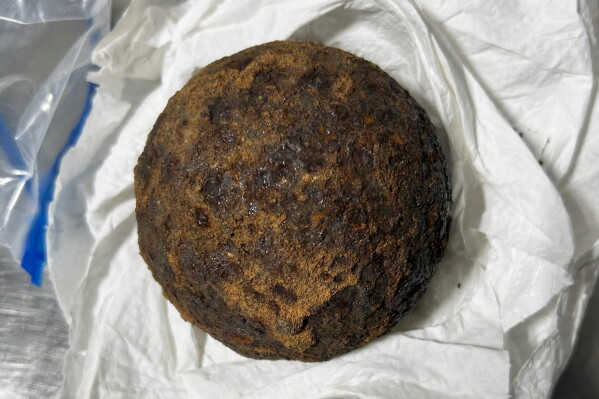 This photo provided by the Transportation Security Administration (TSA) shows a stolen Civil War-era cannonball discovered by TSA officers in a checked bag at the Gulf Shores International Airport in Gulf Shores, Ala., on July 18, 2026. (Transportation Security Administration via AP)