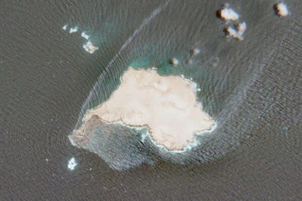 This satellite image released by European Space Agency shows oil leaking from a grounded U.K.-sanctioned tanker near Qibliyah Island off the coast of Oman, Tuesday, July 28, 2026. (European Space Agency via AP)