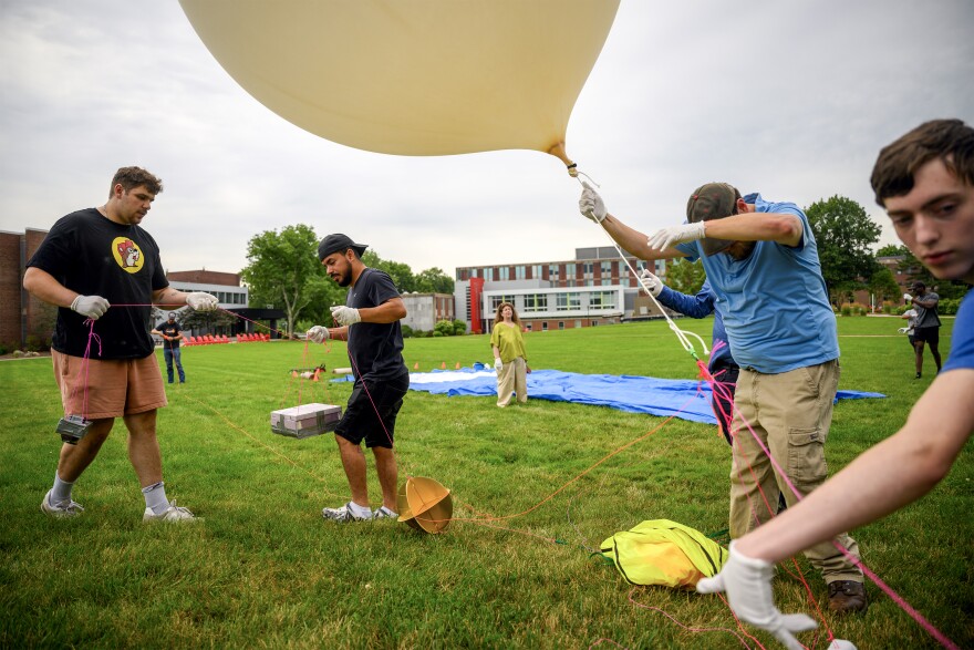 University of Bridgeport students and faculty, alongside students and faculty from the University of Hartford, grab a descending tethered high-altitude balloon July 17, 2026 at University of Hartford in preparation for a NASA-supported solar eclipse research mission during the August 12 eclipse in Burgos, Spain.