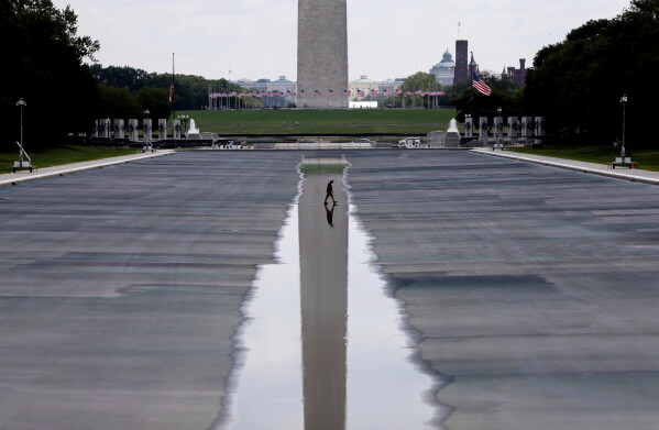 The Washington Monument is seen in the background of the now drained Lincoln Memorial Reflecting Pool, Wednesday, July 29, 2026, in Washington. (AP Photo/Rahmat Gul)