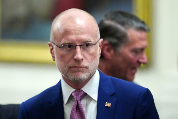 Federal Communications Commission Chairman Brendan Carr departs an event in the East Room of the White House, March 20, 2026, in Washington. (AP Photo/Julia Demaree Nikhinson, File)