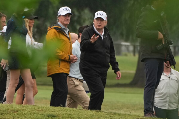 President Donald Trump, right, and Interior Secretary Doug Burgum tour the East Potomac Park golf course, June 28, 2026, in Washington. (AP Photo/Mark Schiefelbein, File)