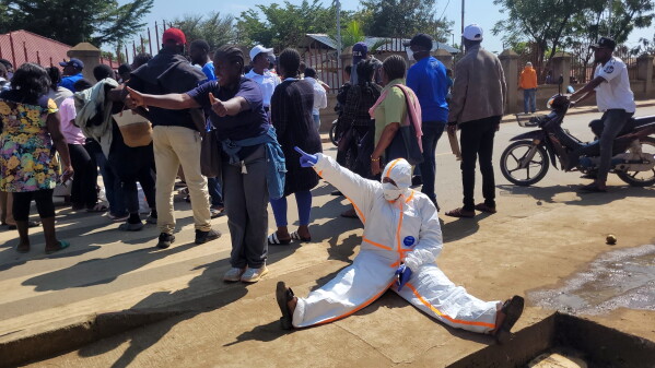 Health workers at the epicenter of the Ebola outbreak protest over unpaid wages at the provincial governor's office in Ituri, eastern Congo, Thursday, Aug. 6, 2026. (AP Photo/Constant Same Bagalwa)
